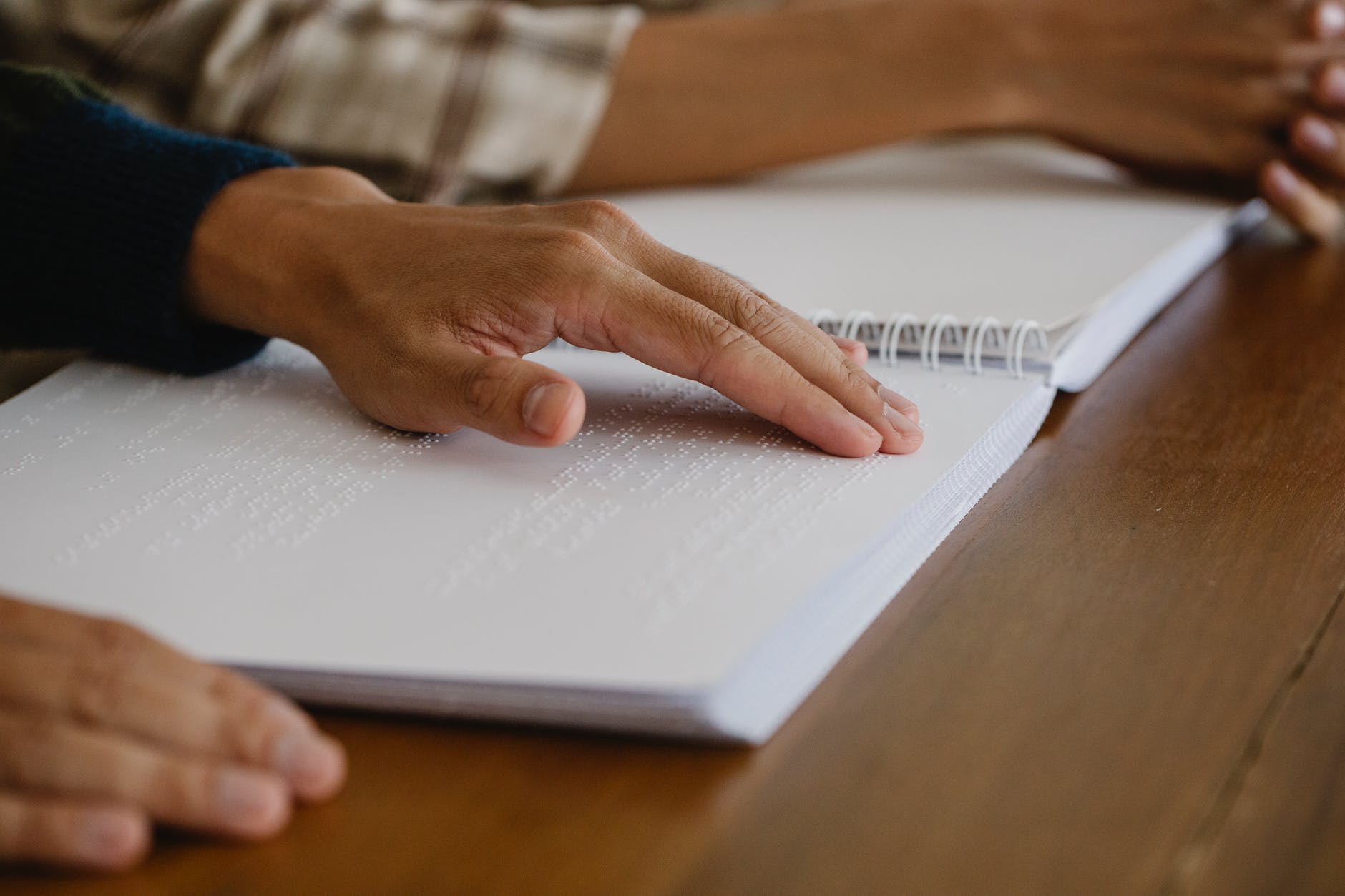 photo of person learning braille